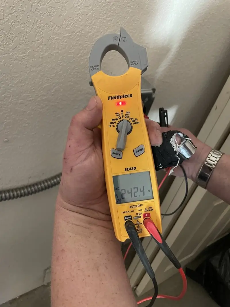 Voltage testing with clamp meter during Recessed Lighting Installation in Bridge City